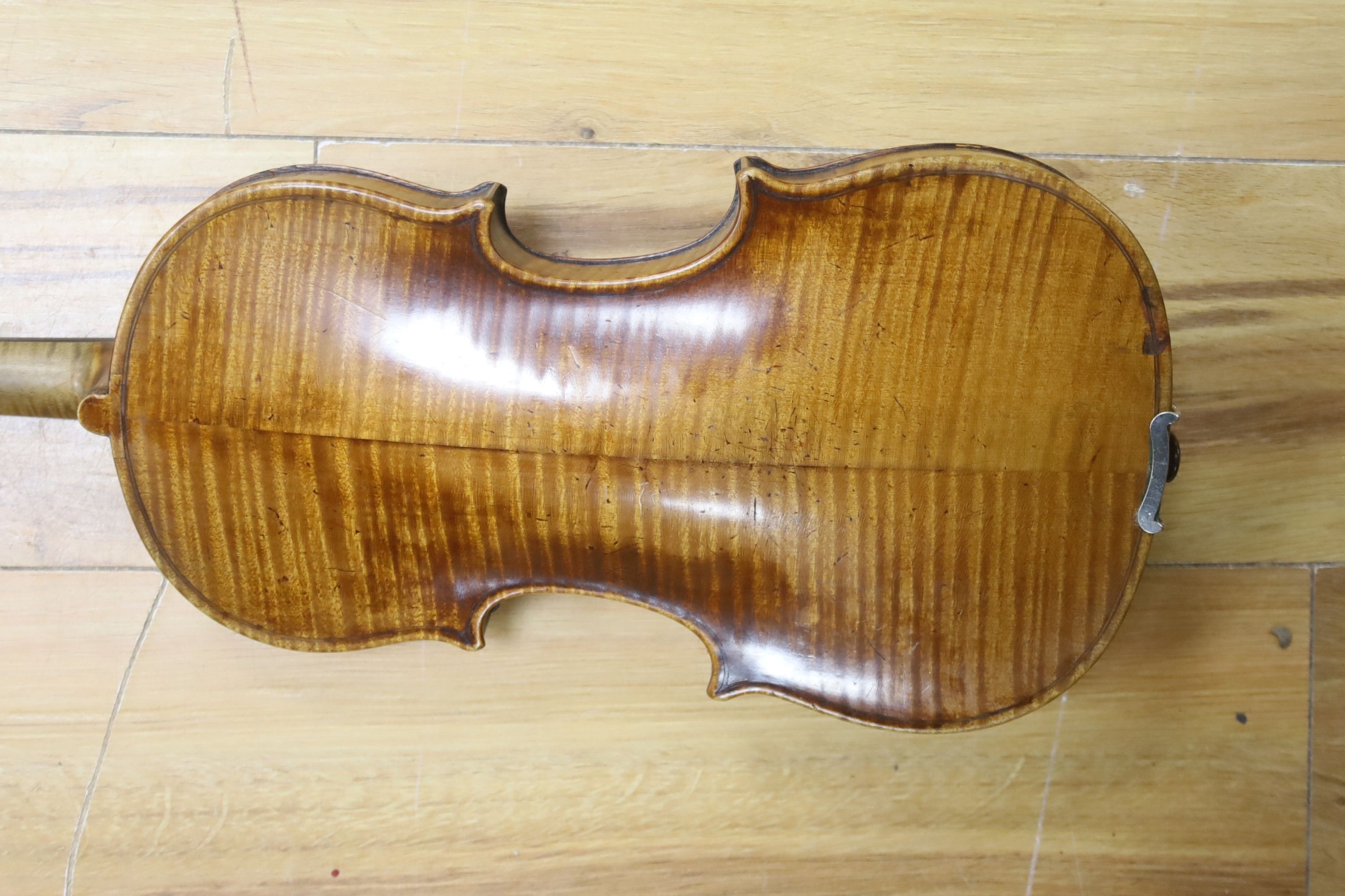 A cased violin and bow